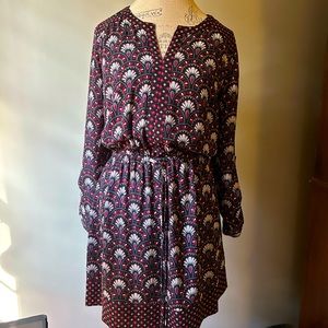 Women’s size medium dress, elastic waist. Lined skirt. Black w/red/gray design